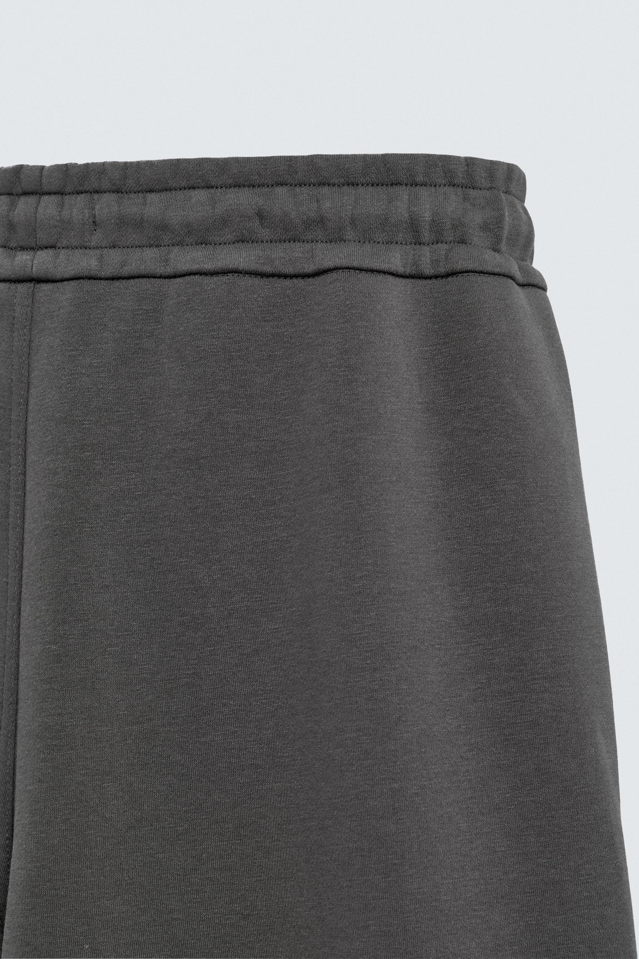 NEOPRENE EFFECT CARGO PANTS WITH PLEATS